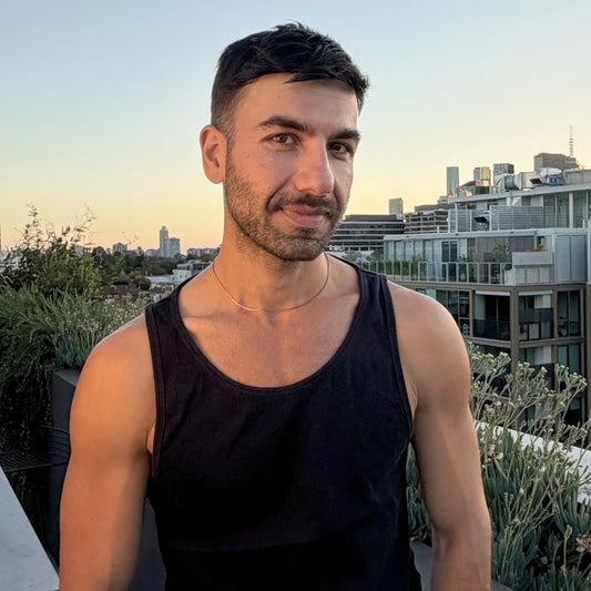 Chain Male gold 1.2mm box chain necklace worn outdoors with city backdrop, minimalist gold men's chain necklace Australia