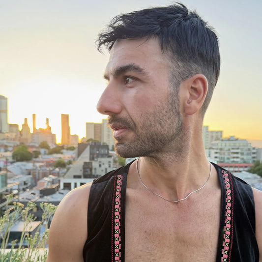 Chain Male silver 1.2mm box chain necklace worn outdoors with city backdrop, minimalist men's chain necklace Australia