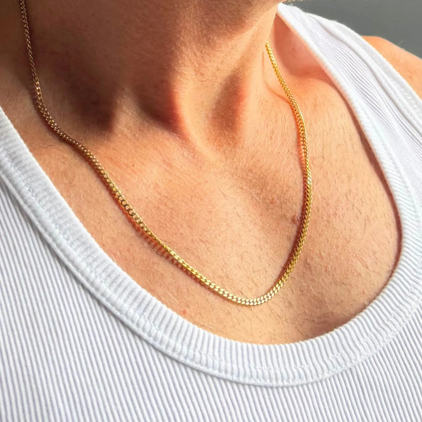 Chain Male gold 3mm curb chain necklace close-up, 18ct gold plated stainless steel men's jewellery