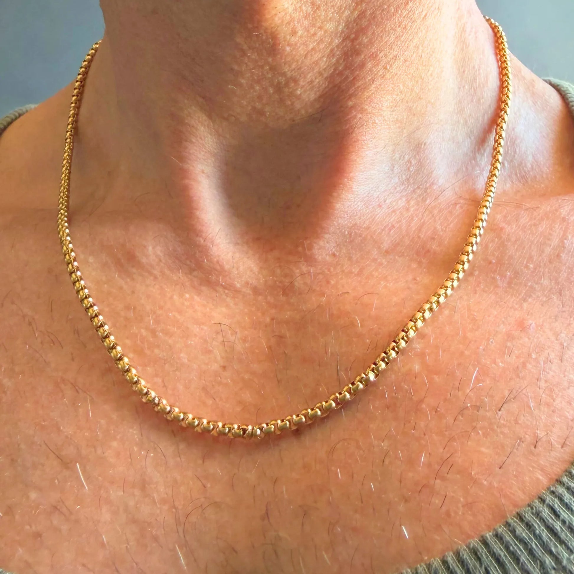 Chain Male gold rolo chain necklace close-up worn with singlet, 18ct gold plated rounded link men's jewellery