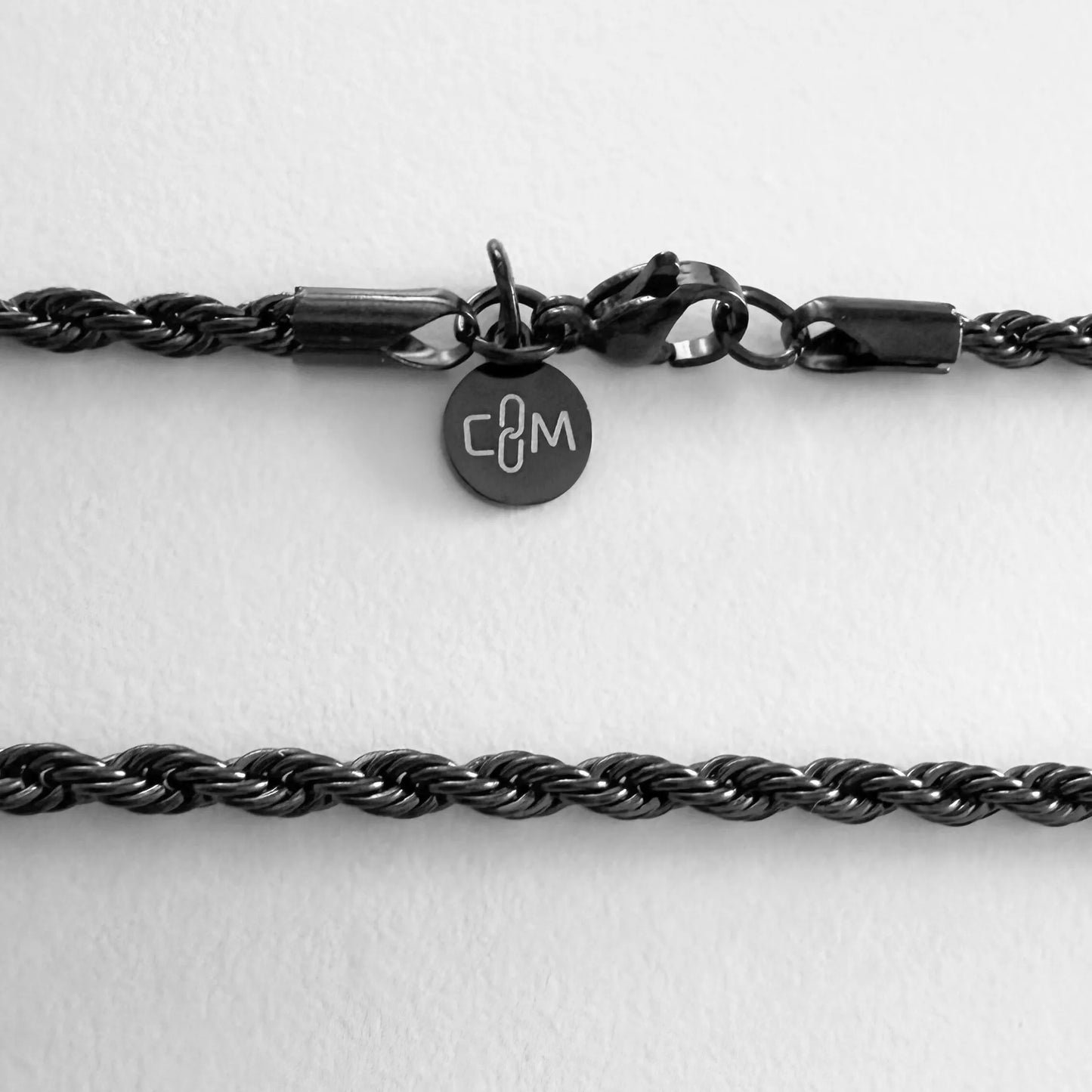 Chain Male black rope chain necklace flat lay with CM charm, black plated men's Everyday collection