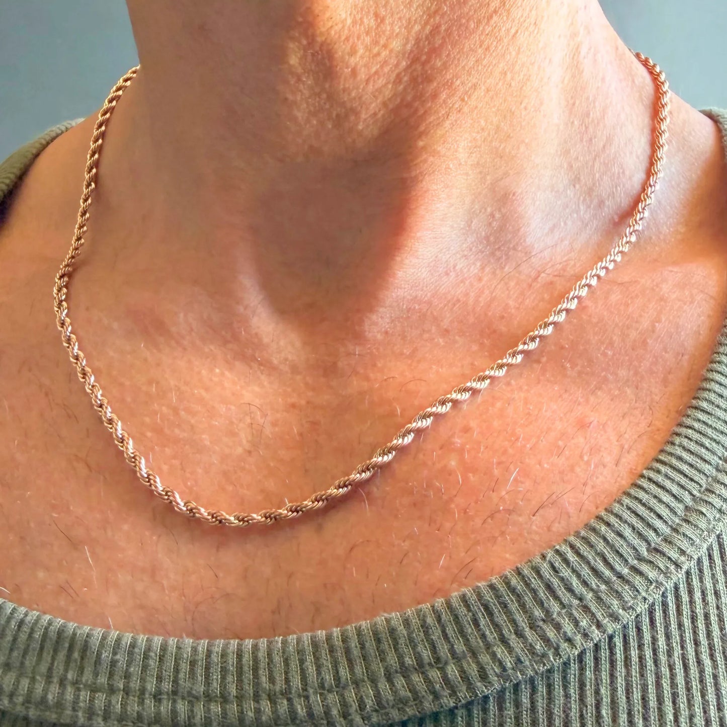 Chain Male rose gold rope chain necklace close-up worn with singlet, rose gold plated twisted men's jewellery