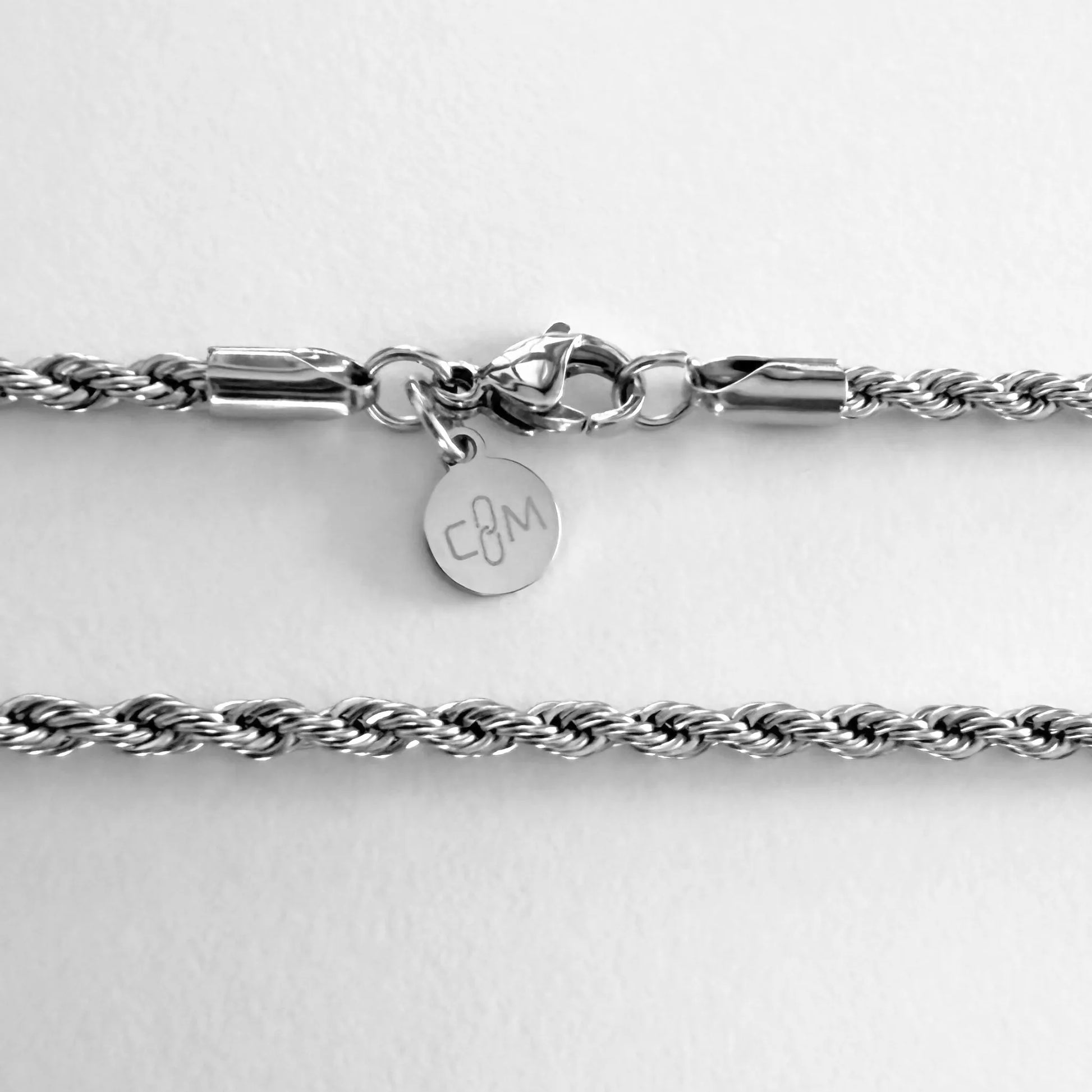 Chain Male silver rope chain necklace flat lay with CM charm, 3mm twisted stainless steel men's Everyday collection