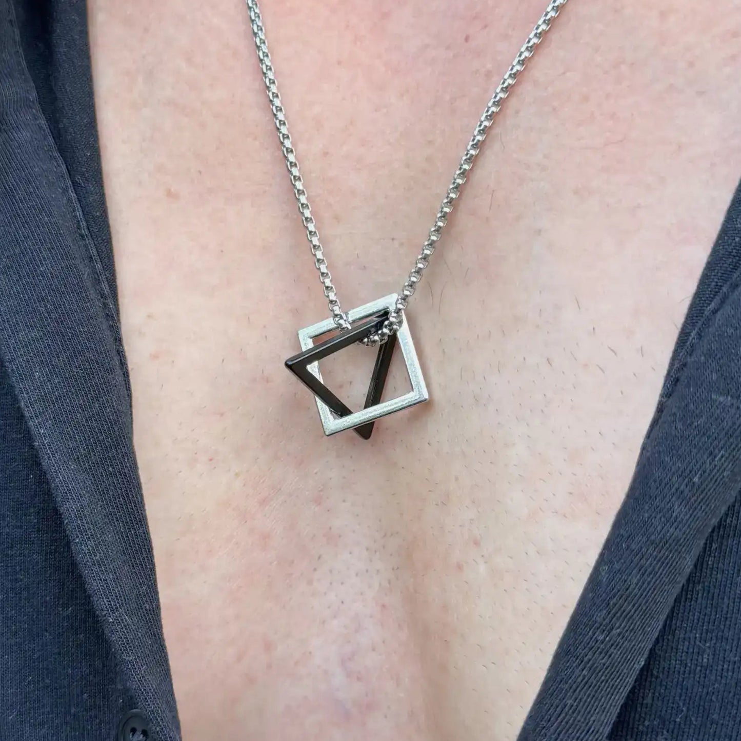 Stainless steel necklace with a geometric pendant worn by a man